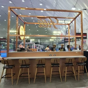 Commercial bar stools and chairs in a modern Dubai café setting showing space-saving arrangements.